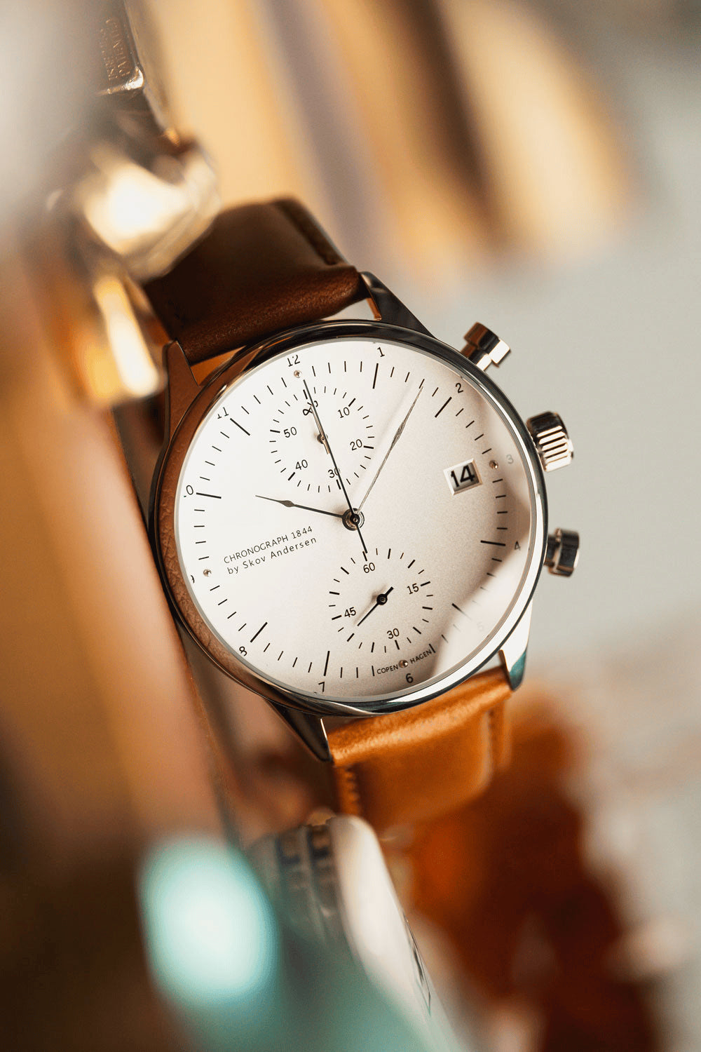 1844 Chronograph by AV86 with precision dial, sapphire crystal, chronograph subdials, date window, and brown leather strap