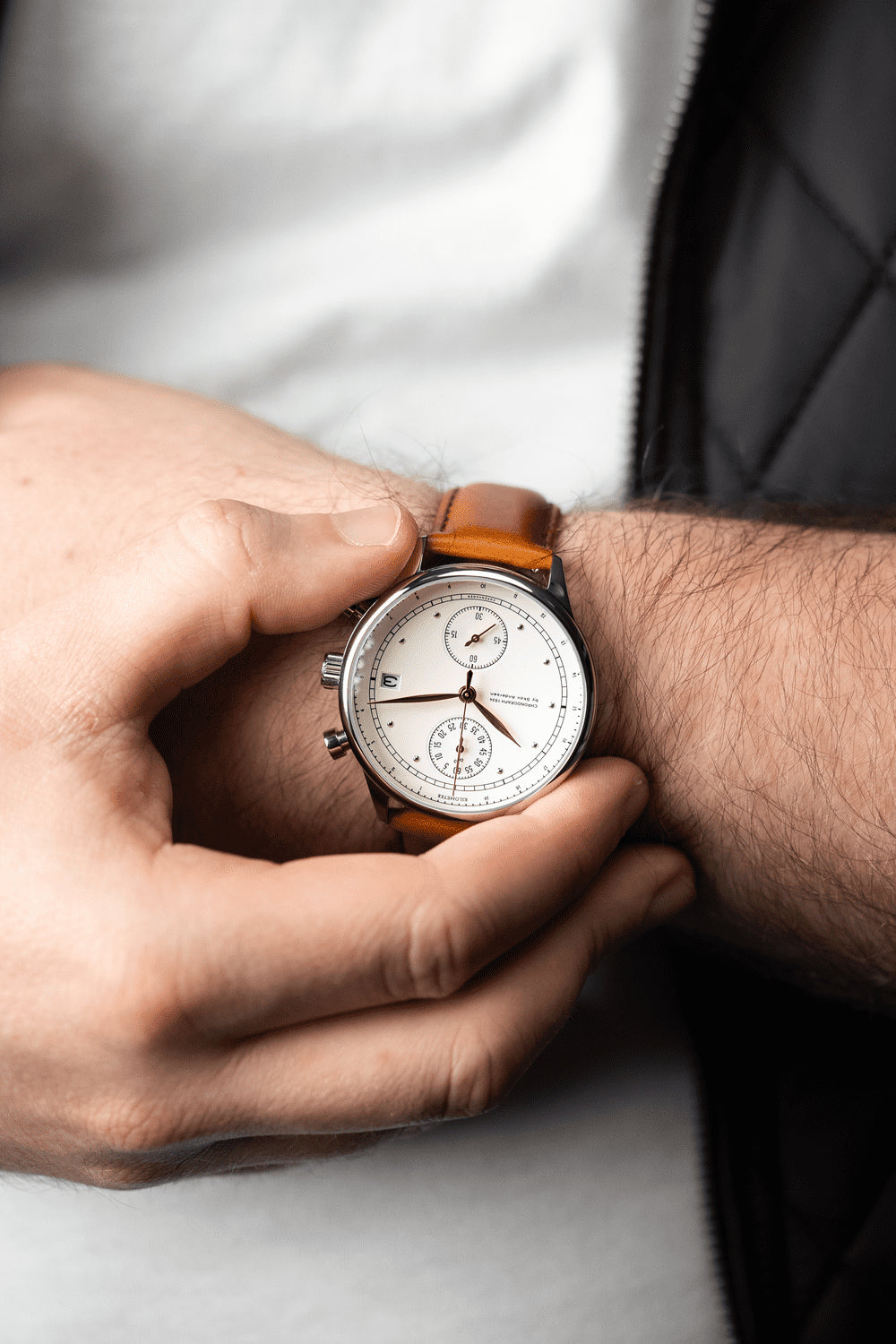 1834 Chronograph by AV86 with sapphire crystal, vintage-inspired dial, chronograph function, and brown leather strap on wrist
