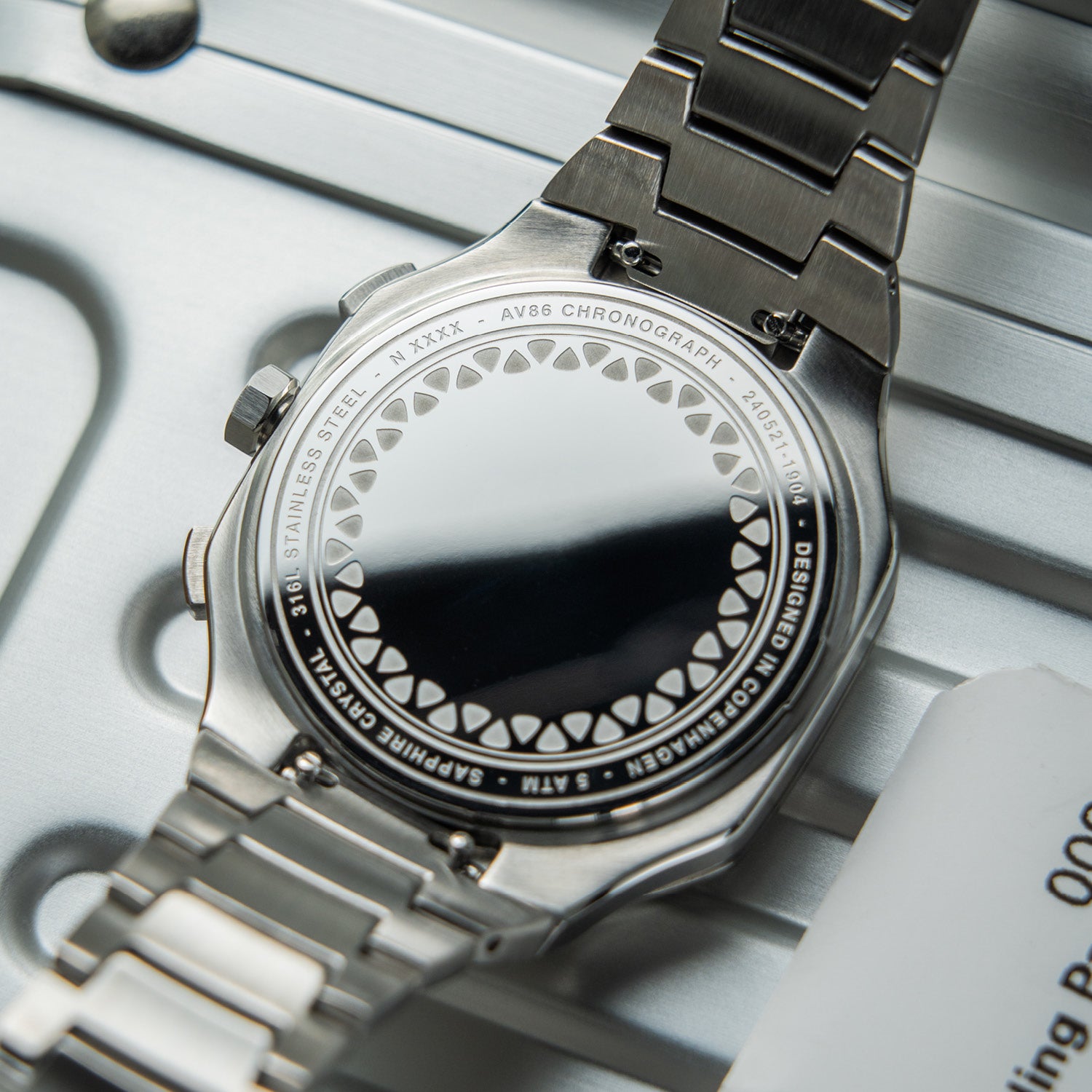 AV86 chronograph with stainless steel case back, sapphire crystal, 5ATM water resistance, and stainless steel bracelet strap