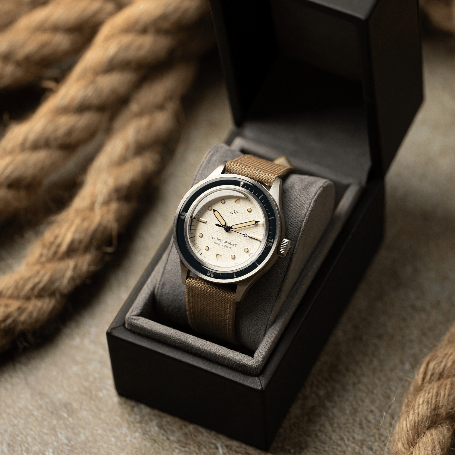 1956 Marine by AV86 vintage-inspired diver with acrylic bezel, luminous markers, and textured fabric strap in presentation box
