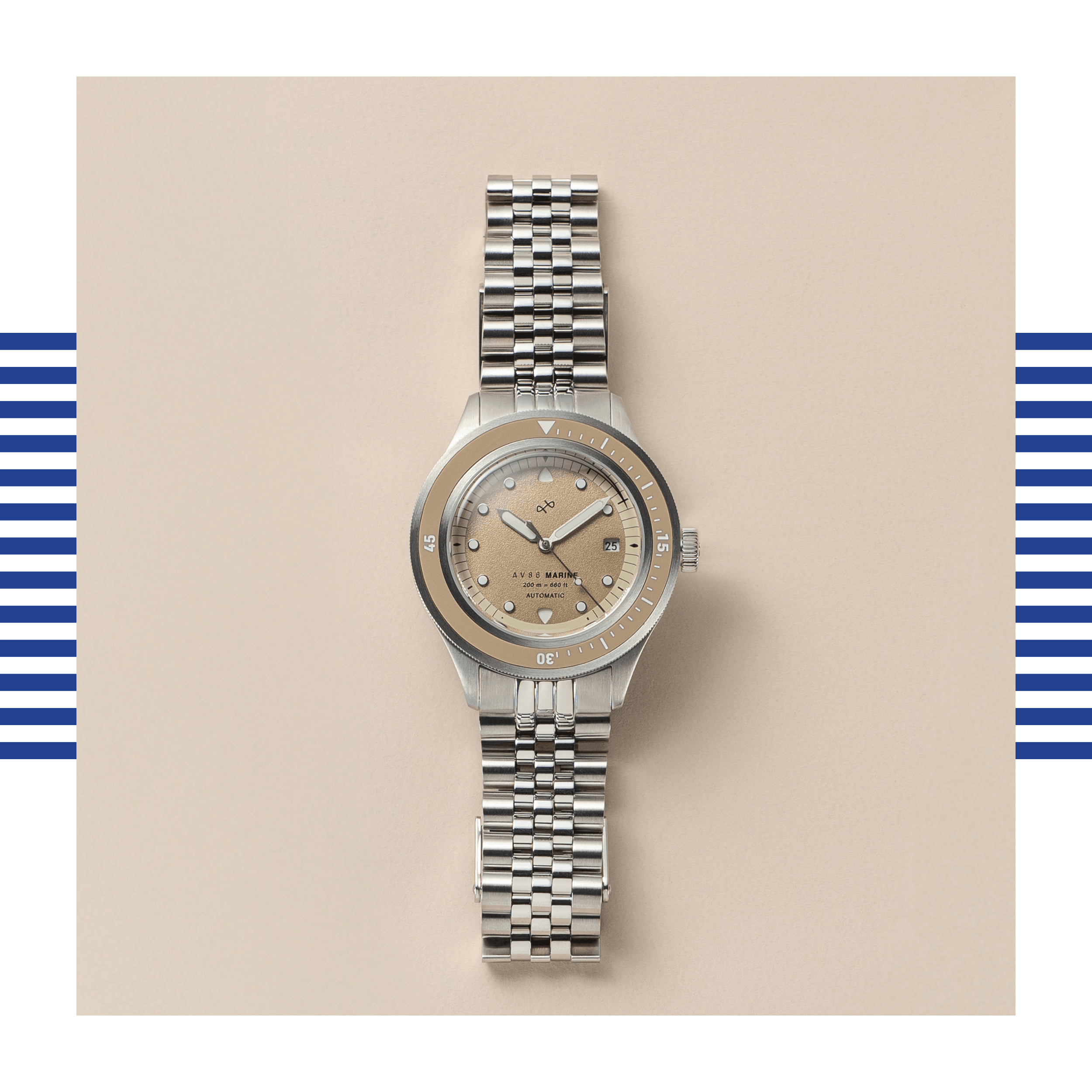 Stainless steel watch with sand-colored dial, round markers, and rotating bezel set against a beige background.