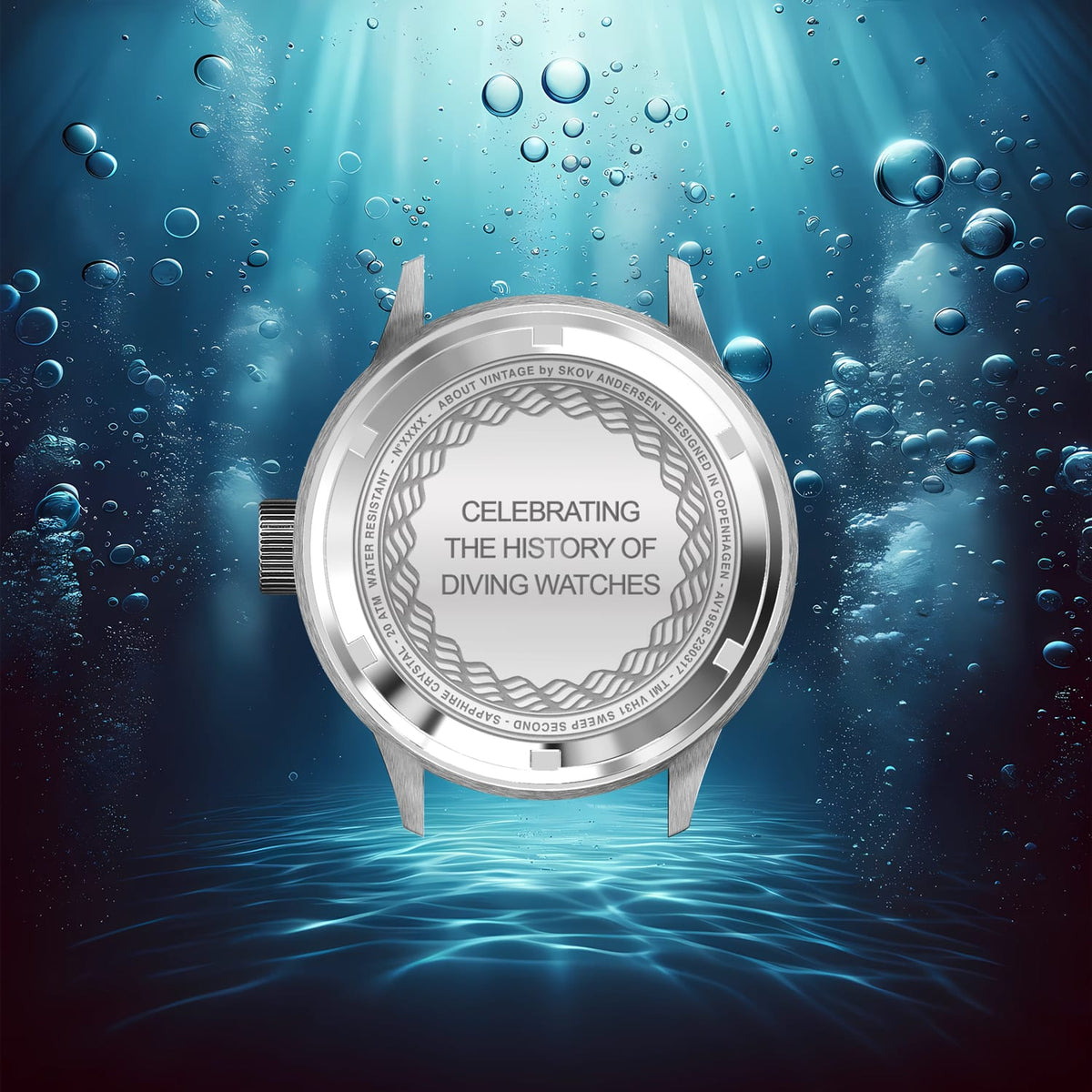Watch caseback floating underwater amid bubbles and blue light, featuring engraved text celebrating the history of diving watches