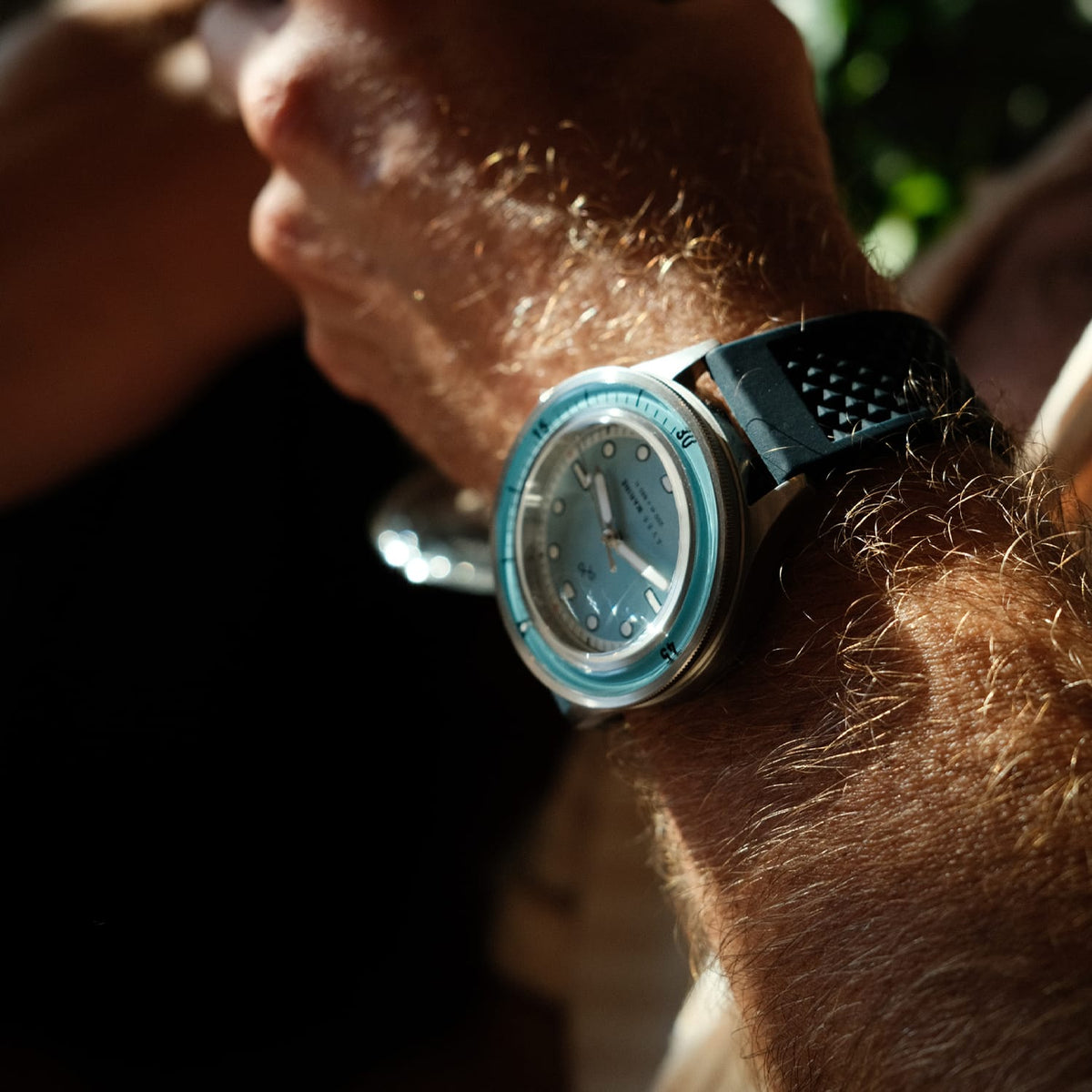 VB86 vintage-inspired diver with sapphire crystal, compass bezel, and textured rubber strap in natural light setting