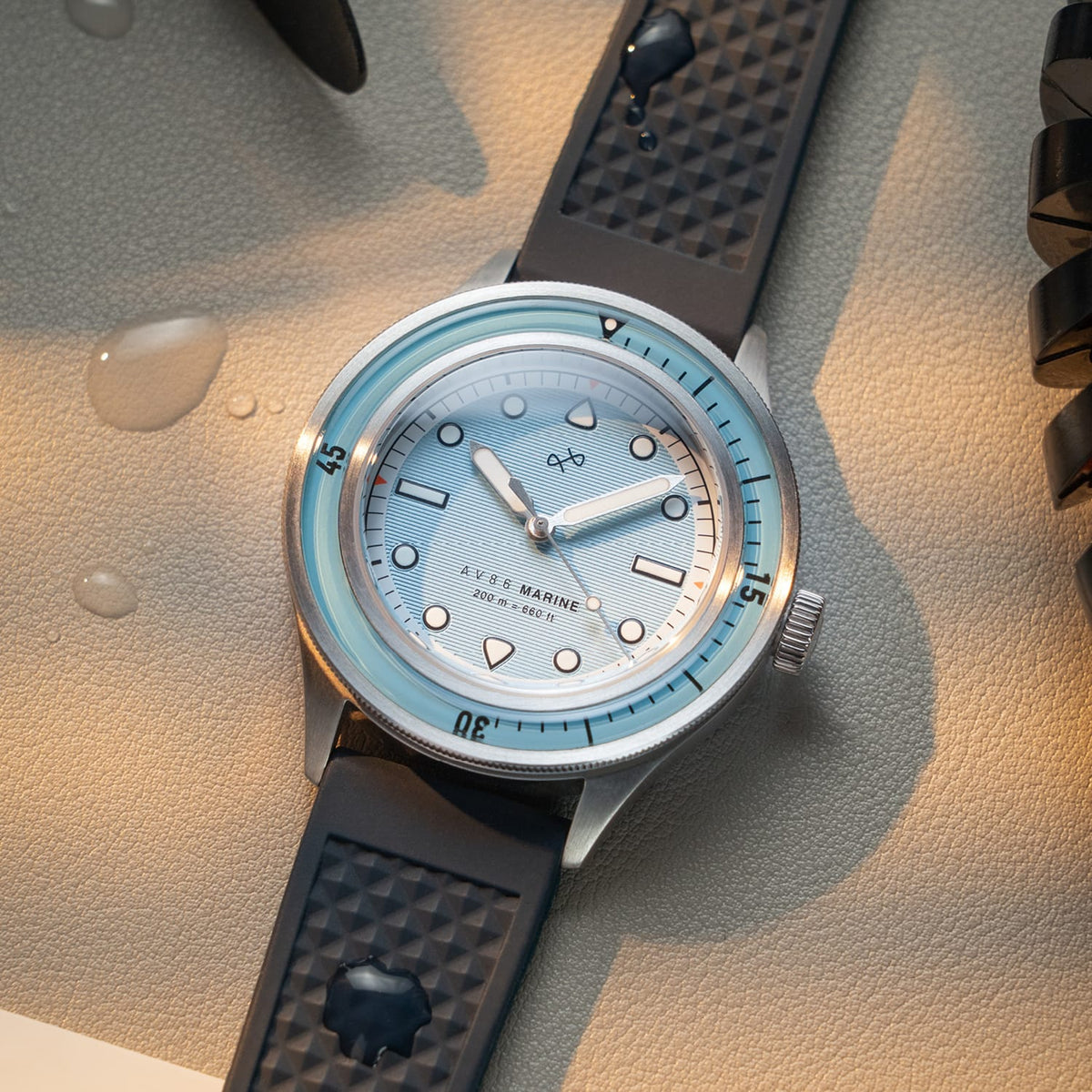 AV86 vintage-inspired diver with sapphire crystal, luminescent dial, rotating bezel, and textured rubber strap in a marine setting