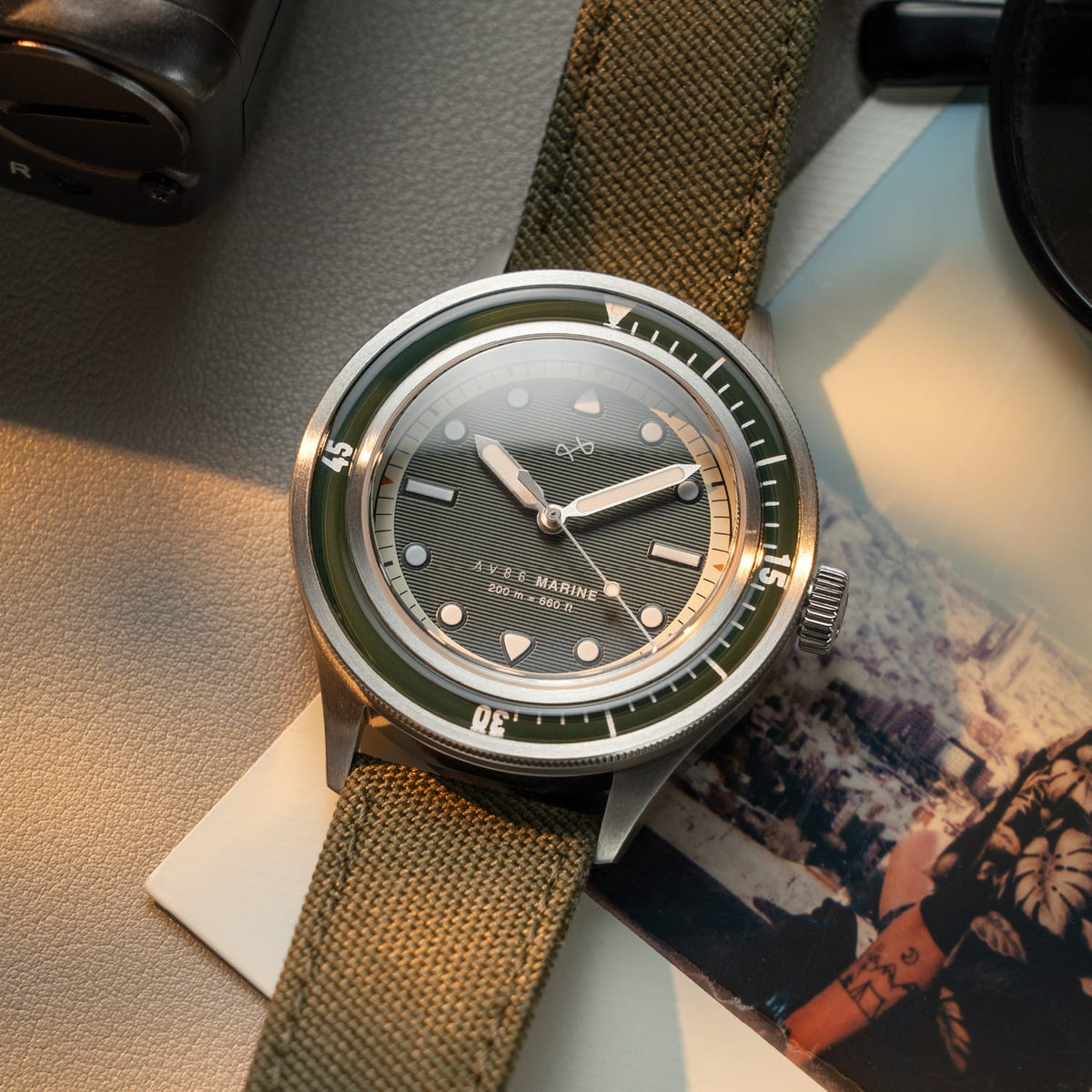 AV86 vintage-inspired diver with sapphire crystal, rotating bezel, textured dial, and rugged fabric strap in natural light setting