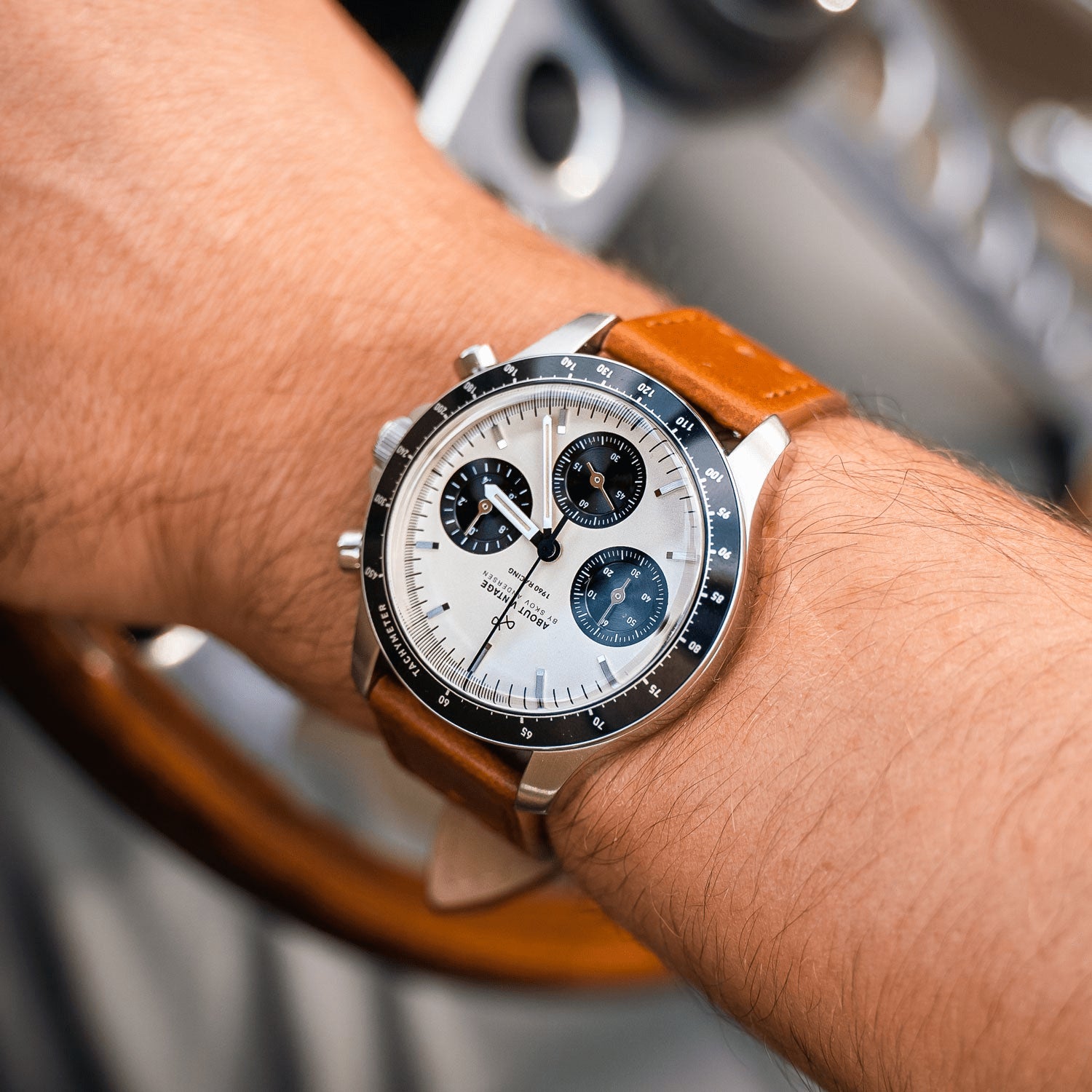 1960 Racing Chronograph by AV86 luxury vintage-inspired chronograph with sapphire crystal, tachymeter bezel, and brown leather strap on wrist