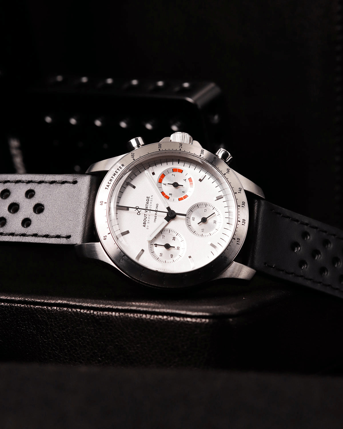 1960 Racing Chronograph by AV86 with vintage-inspired dial, sapphire crystal, tachymeter bezel, and perforated leather strap