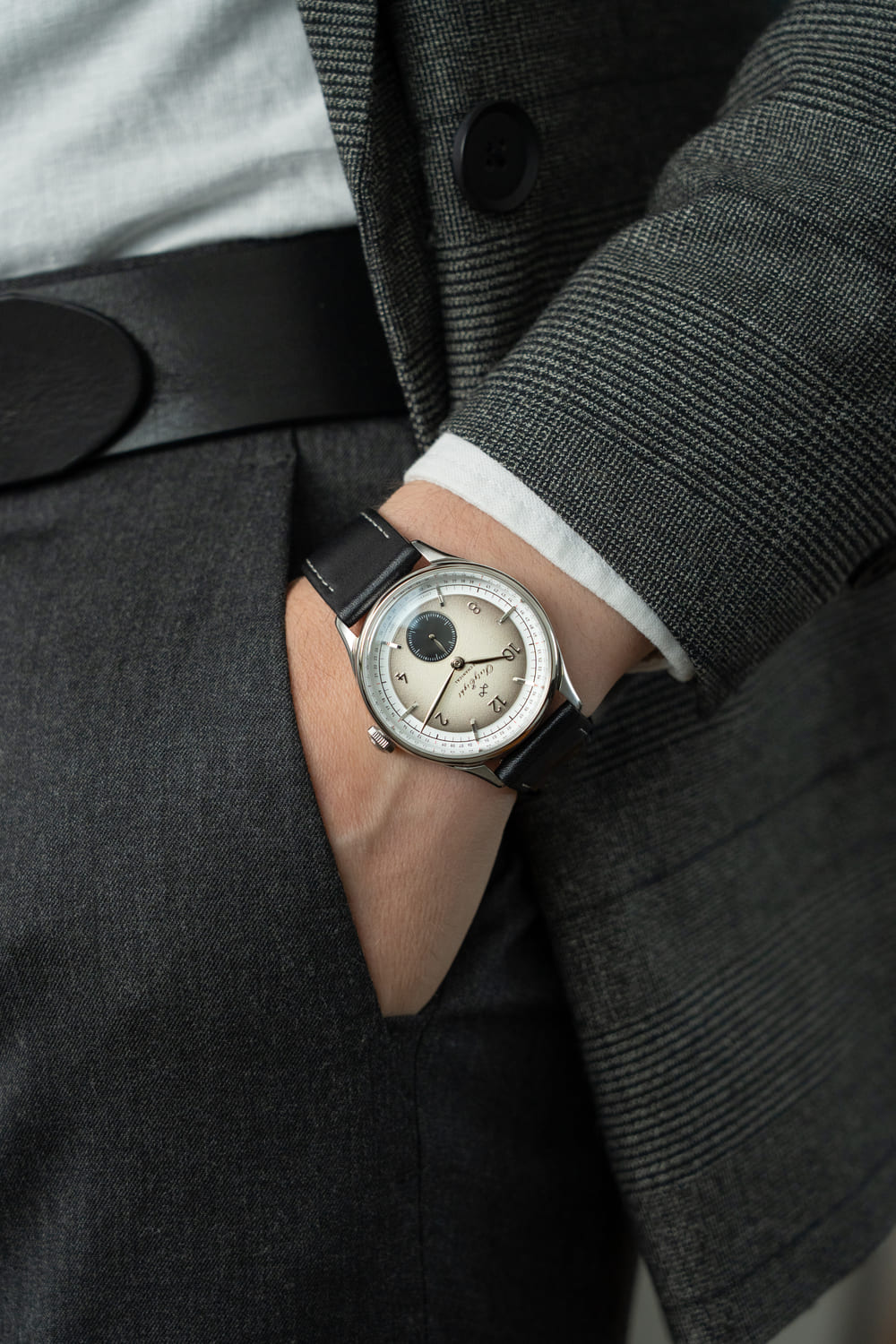 1968 Mechanical (Hand-Wound) by AV86 vintage-inspired dress watch with sapphire crystal and black leather strap on wrist
