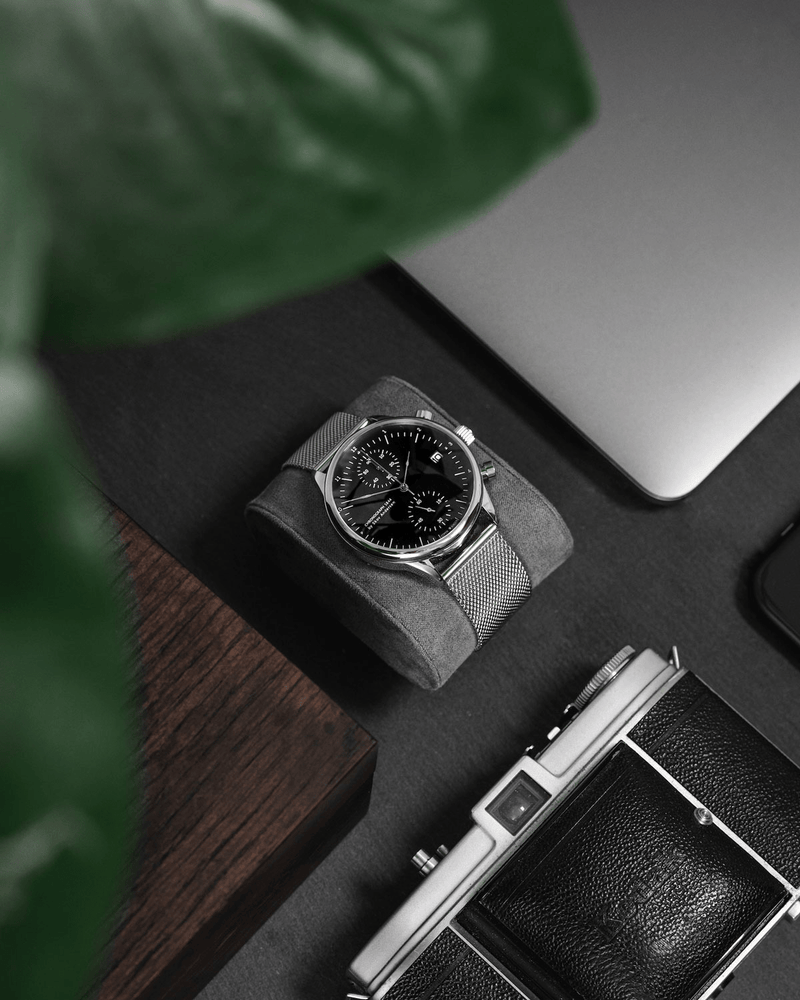 1844 Chronograph by AV86 with vintage-inspired dial, precise timing lines, sapphire crystal, and mesh metal strap in minimalist setting