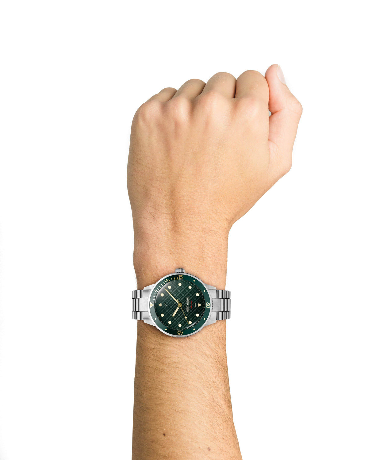 AV86 watch with a green dial, luminous markers, polished case, and metal bracelet worn on a raised wrist against a plain background