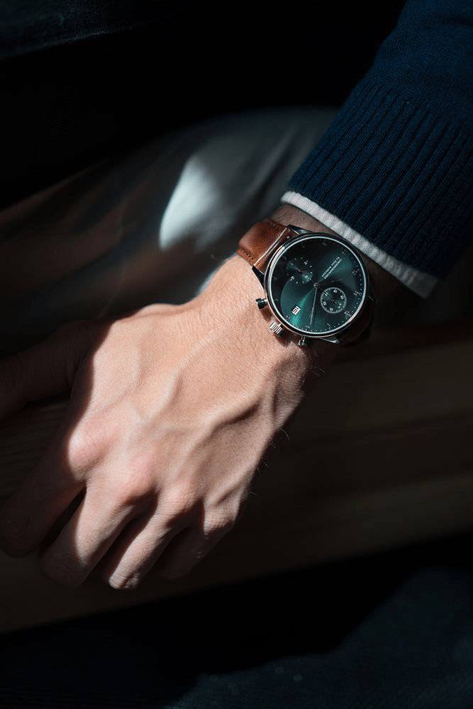 1815 Chronograph by AV86 with vintage-inspired dial, sapphire crystal, chronograph subdials, and brown leather strap on wrist