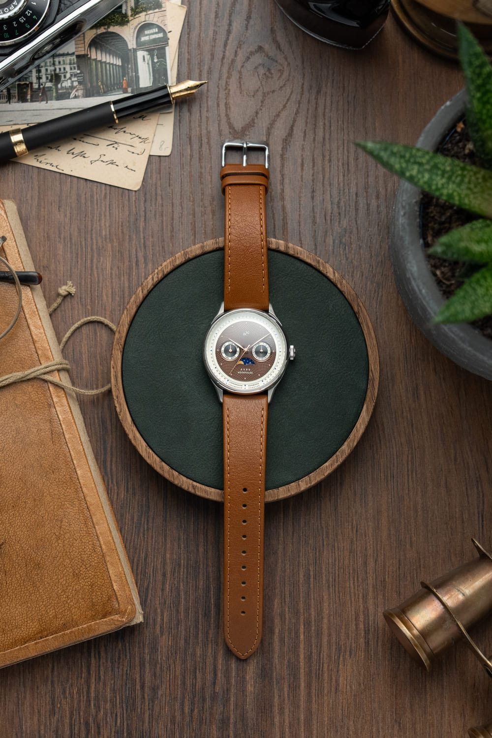 1968 Moonphase by AV86 luxury moonphase watch with sapphire crystal, vintage-inspired dial, and brown leather strap on display tray