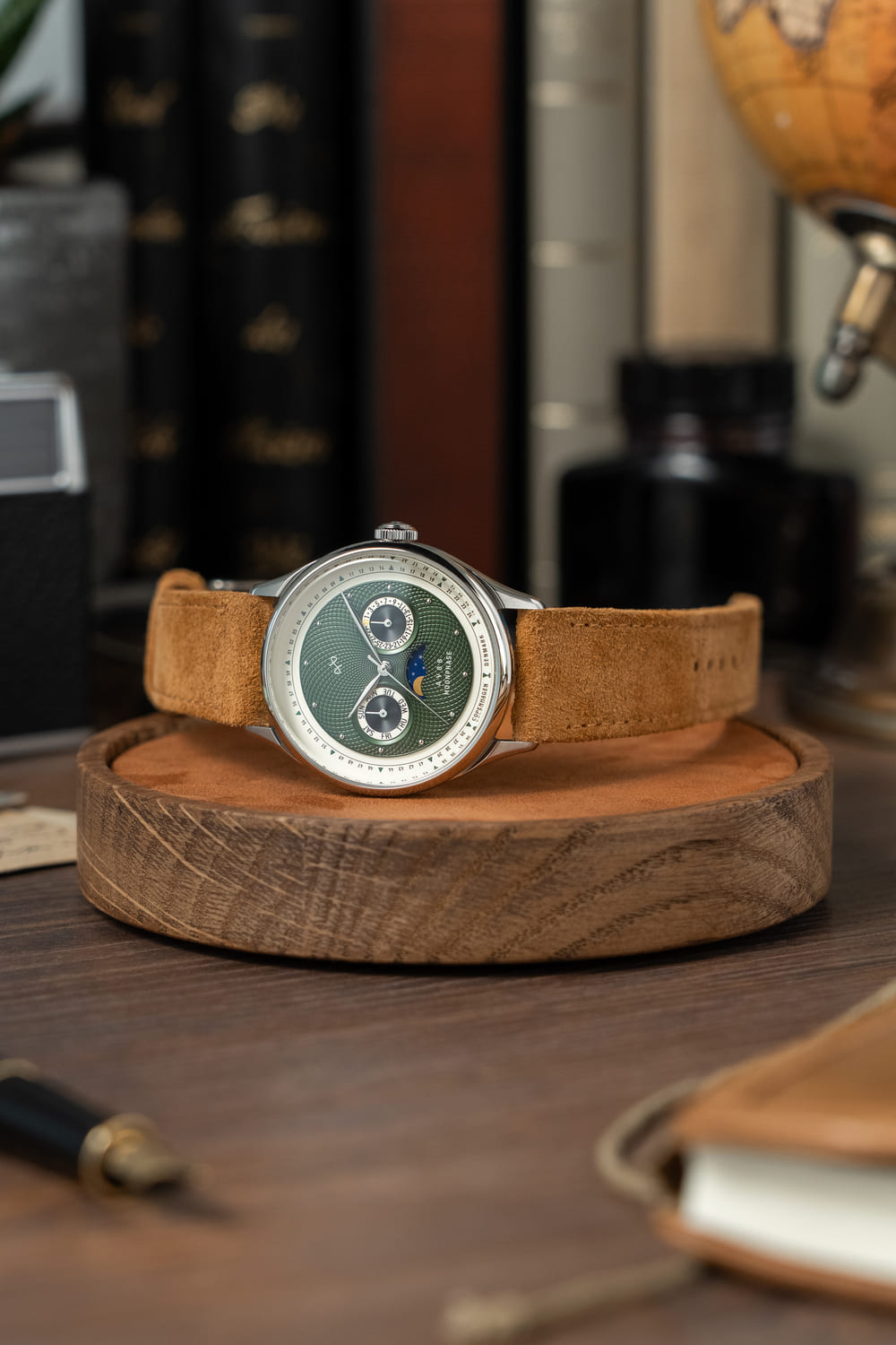 1968 Moonphase by AV86 luxury moonphase watch with sapphire crystal, vintage-inspired dial, and suede leather strap on wooden stand