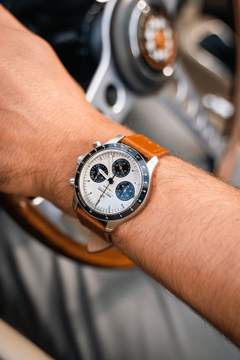 1960 Racing Chronograph by AV86 with vintage-inspired dial, sapphire crystal, chronograph function, and brown leather strap on wrist