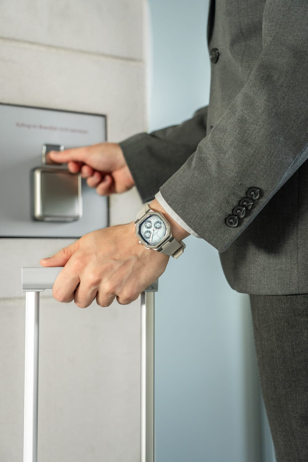 1904 Chronograph by AV86 luxury chronograph with angular case, sapphire crystal, and steel metal bracelet in business setting
