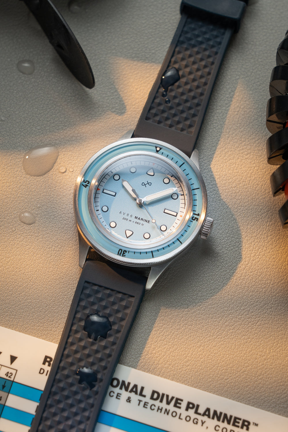 1956 Marine by AV86 vintage-inspired diver watch with sapphire crystal, compass bezel, and textured rubber strap
