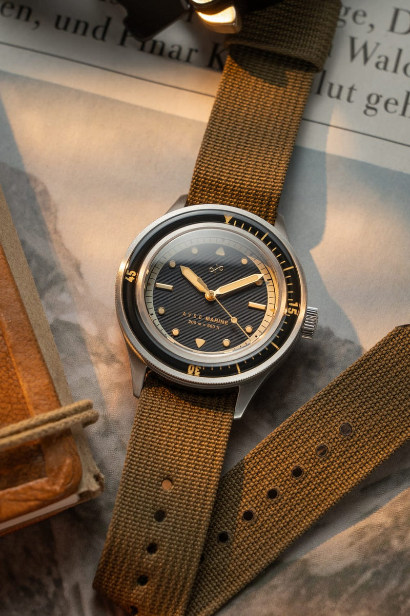 1956 Marine by AV86 vintage-inspired diver watch with sapphire crystal, rotating bezel, textured dial, and fabric strap
