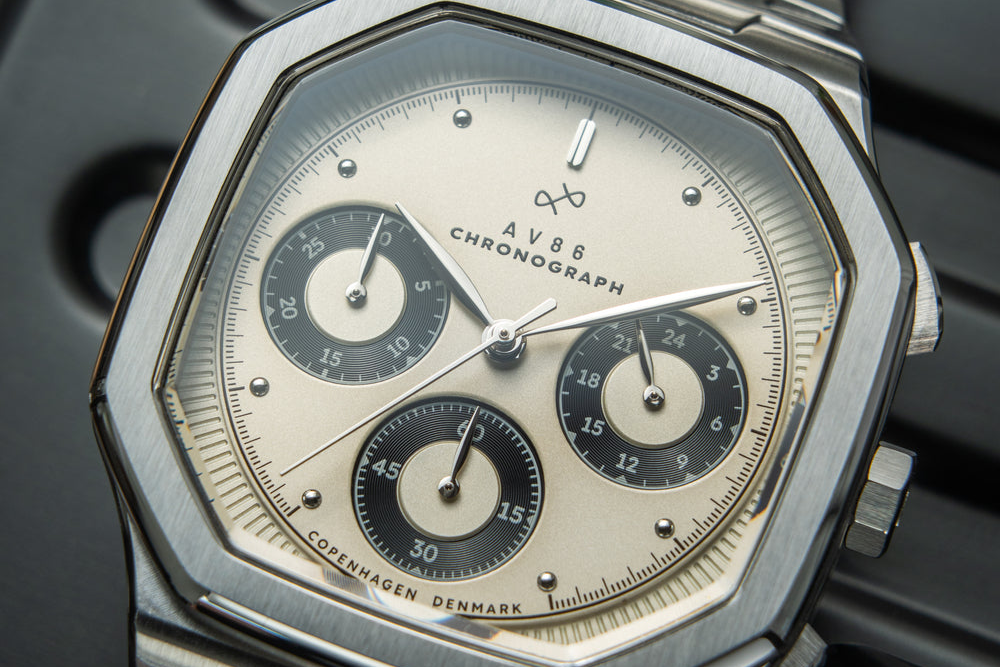 AV86 chronograph with vintage-inspired dial, three subdials, sapphire crystal, stainless steel case, and integrated bracelet strap