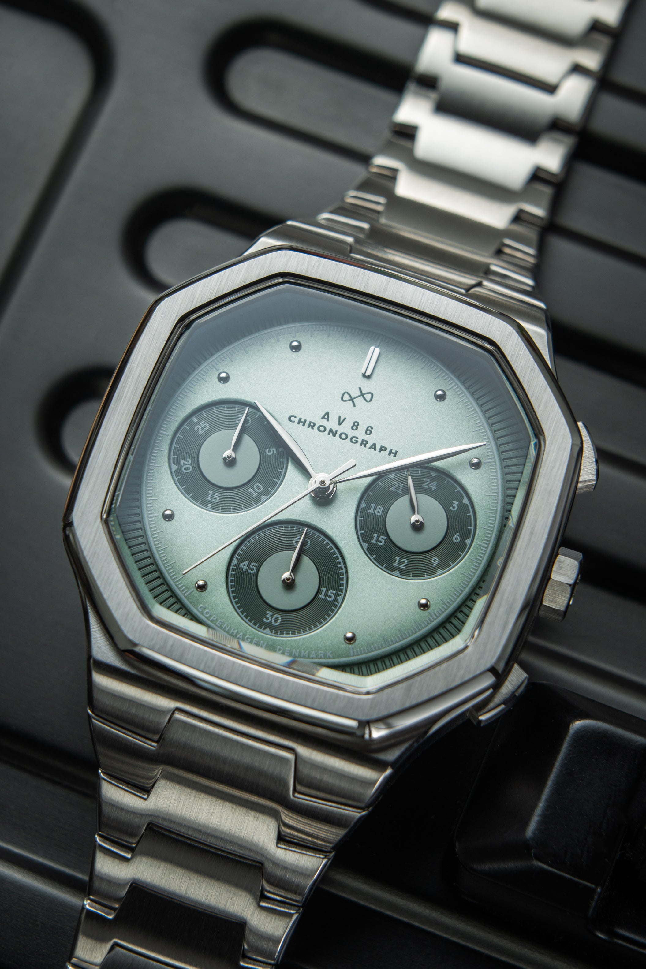 1904 Chronograph by AV86 with angular case, sapphire crystal, vintage dial, chronograph subdials, and brushed metal bracelet strap