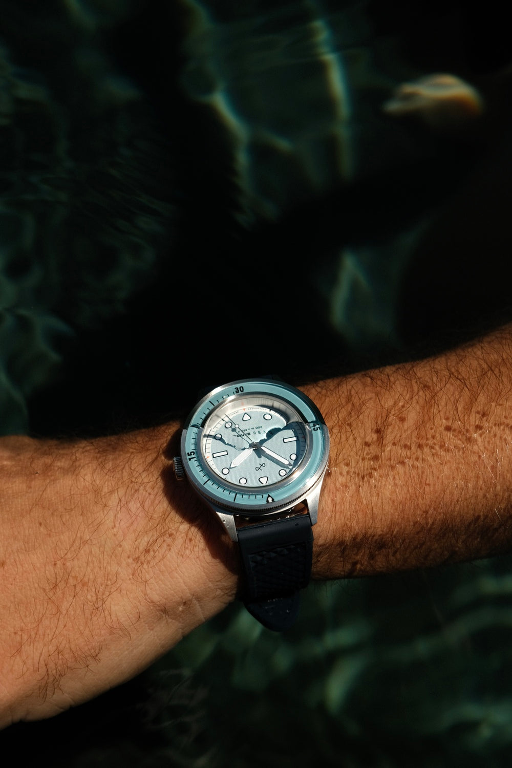 1956 Marine by AV86 vintage-inspired diver with sapphire crystal, compass bezel, and textured rubber strap on wrist