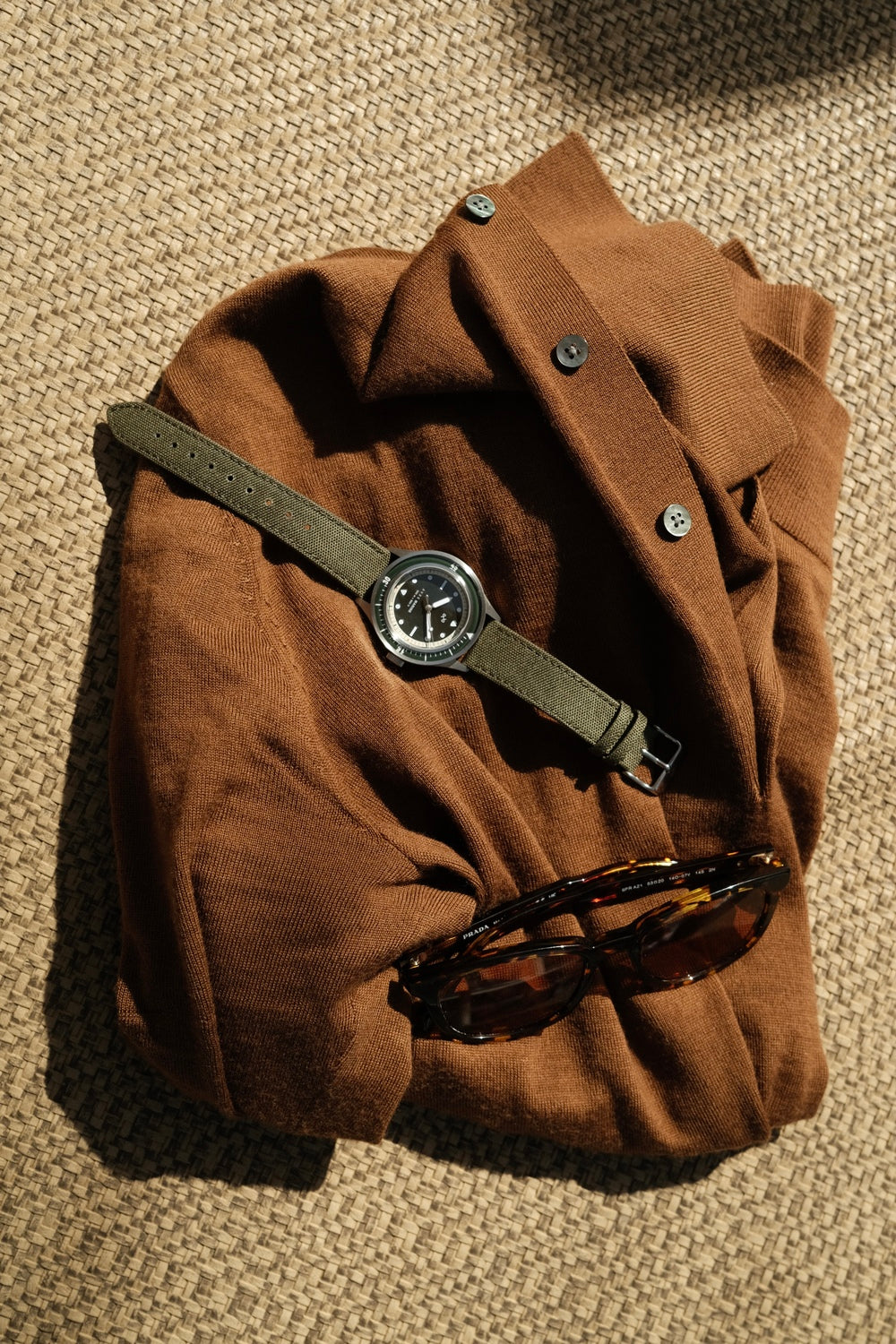 1956 Marine by AV86 vintage-inspired diver watch with sapphire crystal, compass bezel, and textured fabric strap on casual attire