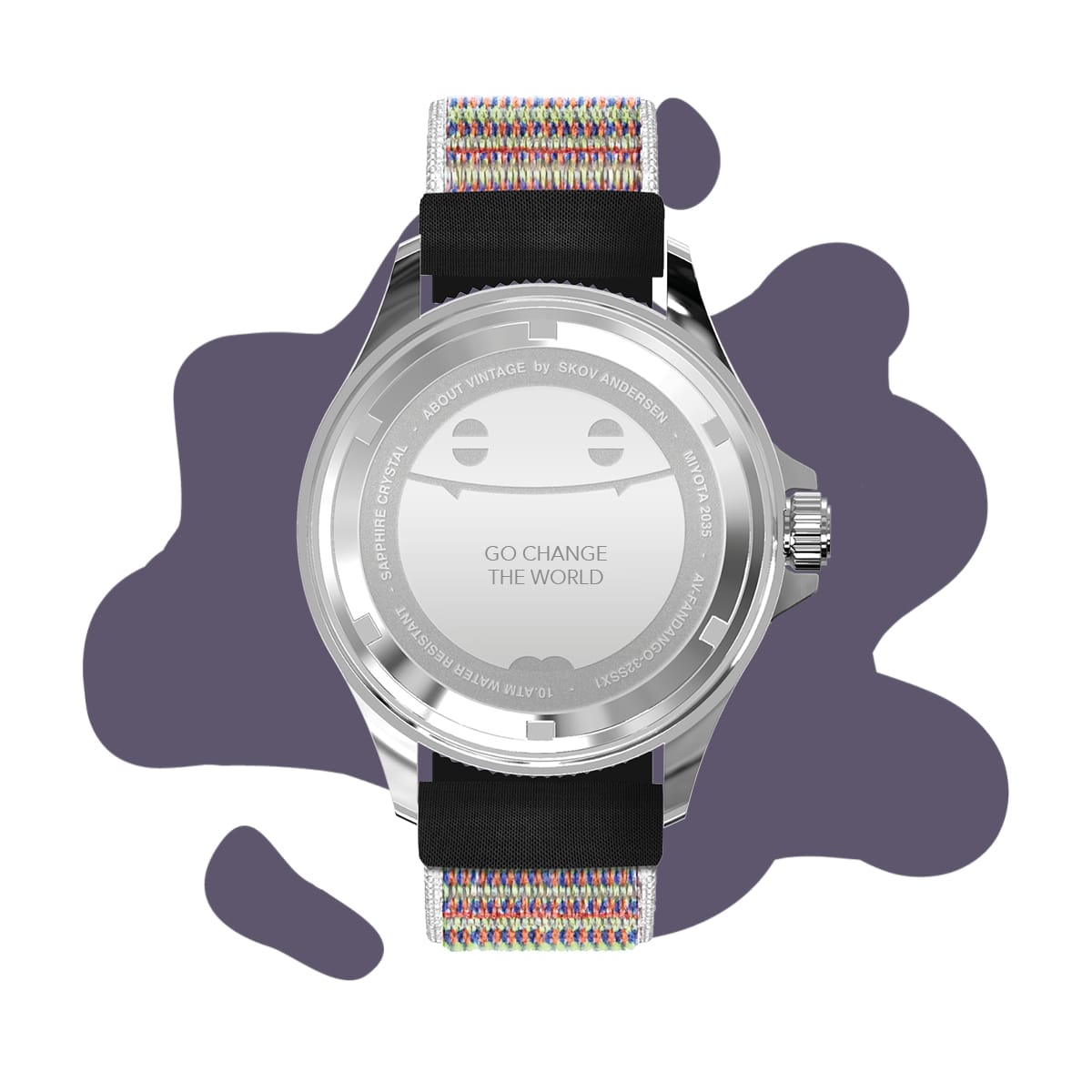 AV86 watch with polished caseback, engraved circular text and smile motif, paired with a black and multicolored woven strap on an abstract purple backdrop