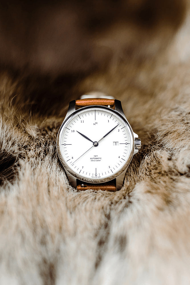 1971 Automatic Swiss Made by AV86 with minimalist dial, date window, sapphire crystal, and brown leather strap