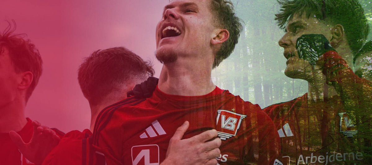Group of enthusiastic men in red sports jerseys celebrating with joyful expressions outdoors in natural light setting