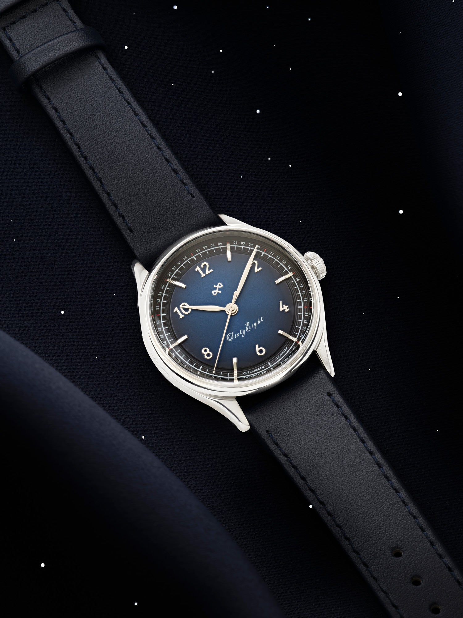 1968 Sixtyeight by AV86 vintage-inspired dress watch with sapphire crystal, blue sunray dial, and black leather strap