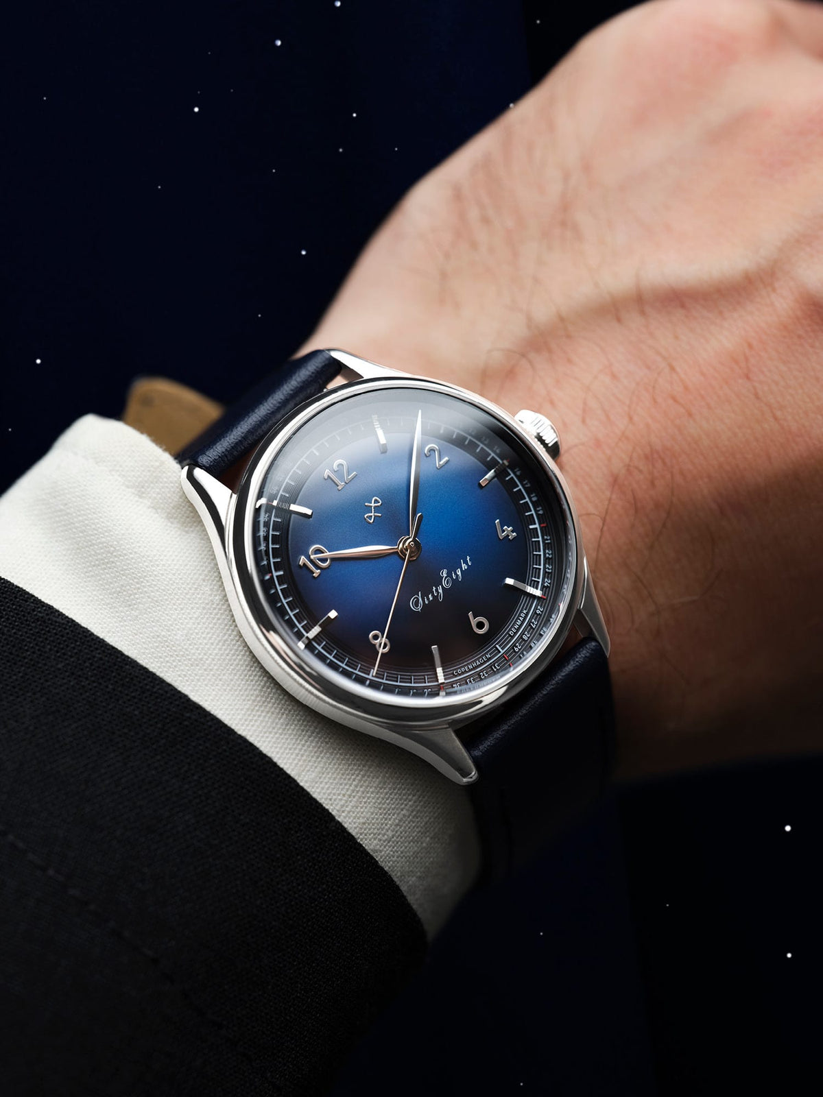 1968 Sixtyeight by AV86 vintage-inspired dress watch with sapphire crystal, blue sunray dial, and black leather strap