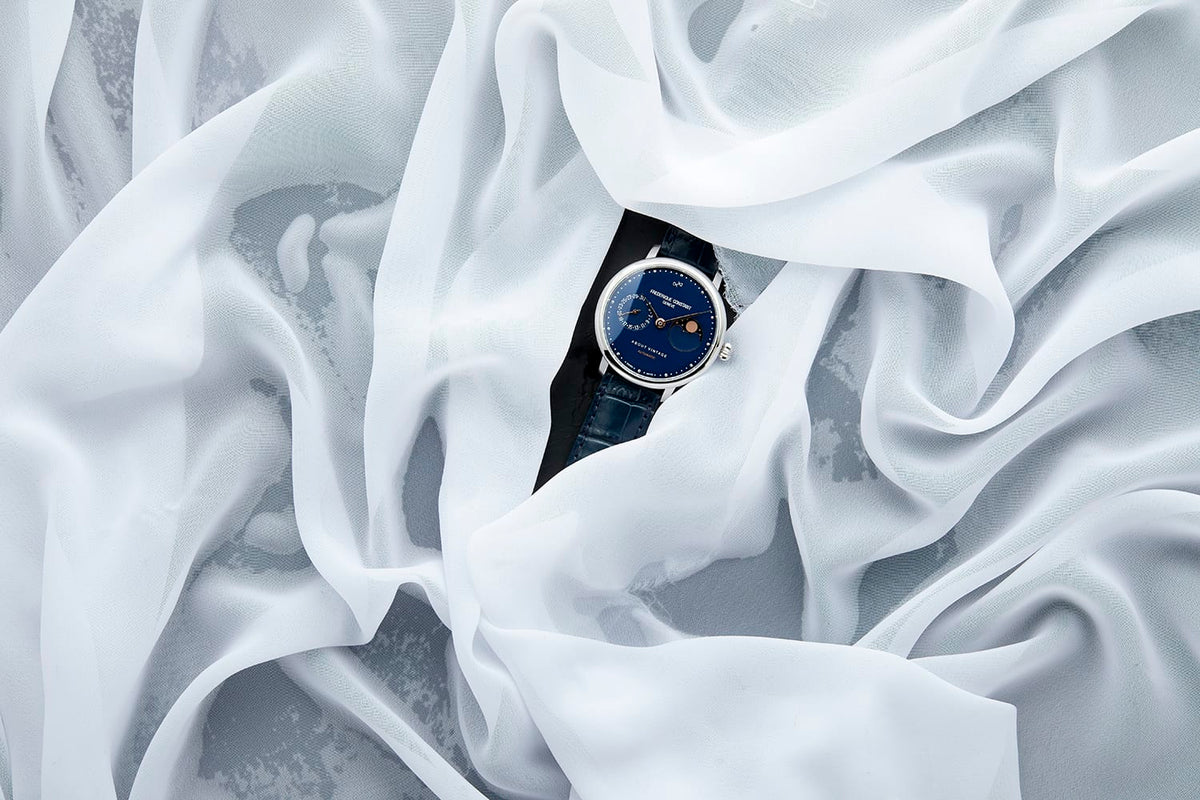 1988 Moonphase, Limited Edition by AV86 luxury automatic moonphase with sapphire crystal and leather strap on sheer fabric backdrop