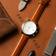 1844 Chronograph by AV86 luxury timepiece with vintage-inspired dial, sapphire crystal, and brown leather strap on a leather surface