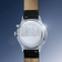1564 Chronodate Automatic by AV86 showing polished stainless steel case back with cityscape engraving and black leather strap