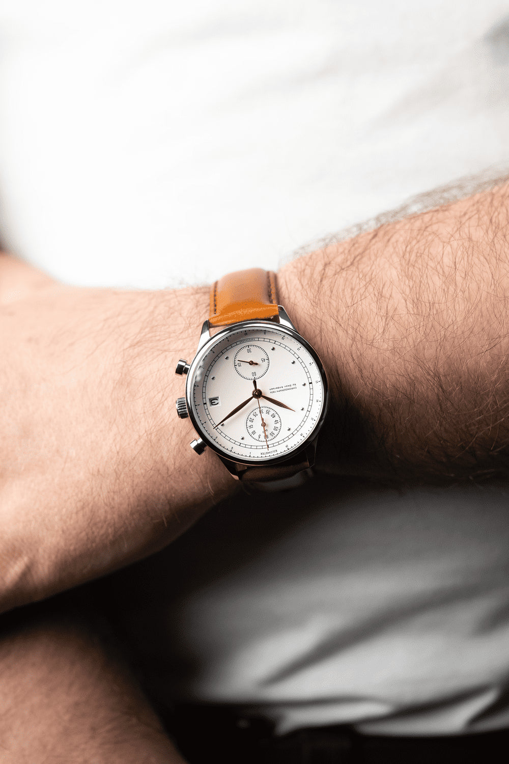 1834 Chronograph by AV86 vintage-inspired chronograph with sapphire crystal, subdials, and brown leather strap on wrist