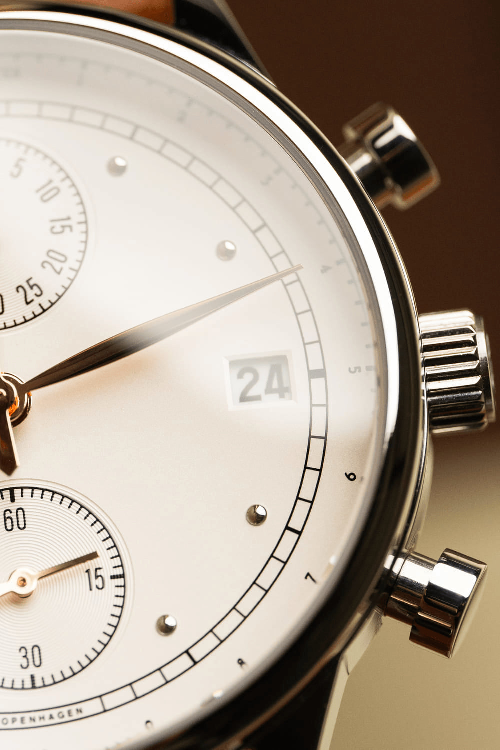 1834 Chronograph by AV86 luxury vintage-inspired chronograph with sapphire crystal, date window, and polished steel case close-up