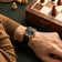 1954 Amalfi Mechanical, Gold / Midnight Blue by AV86 luxury dress watch with sapphire crystal, small seconds, and textured leather strap on wrist near chessboard
