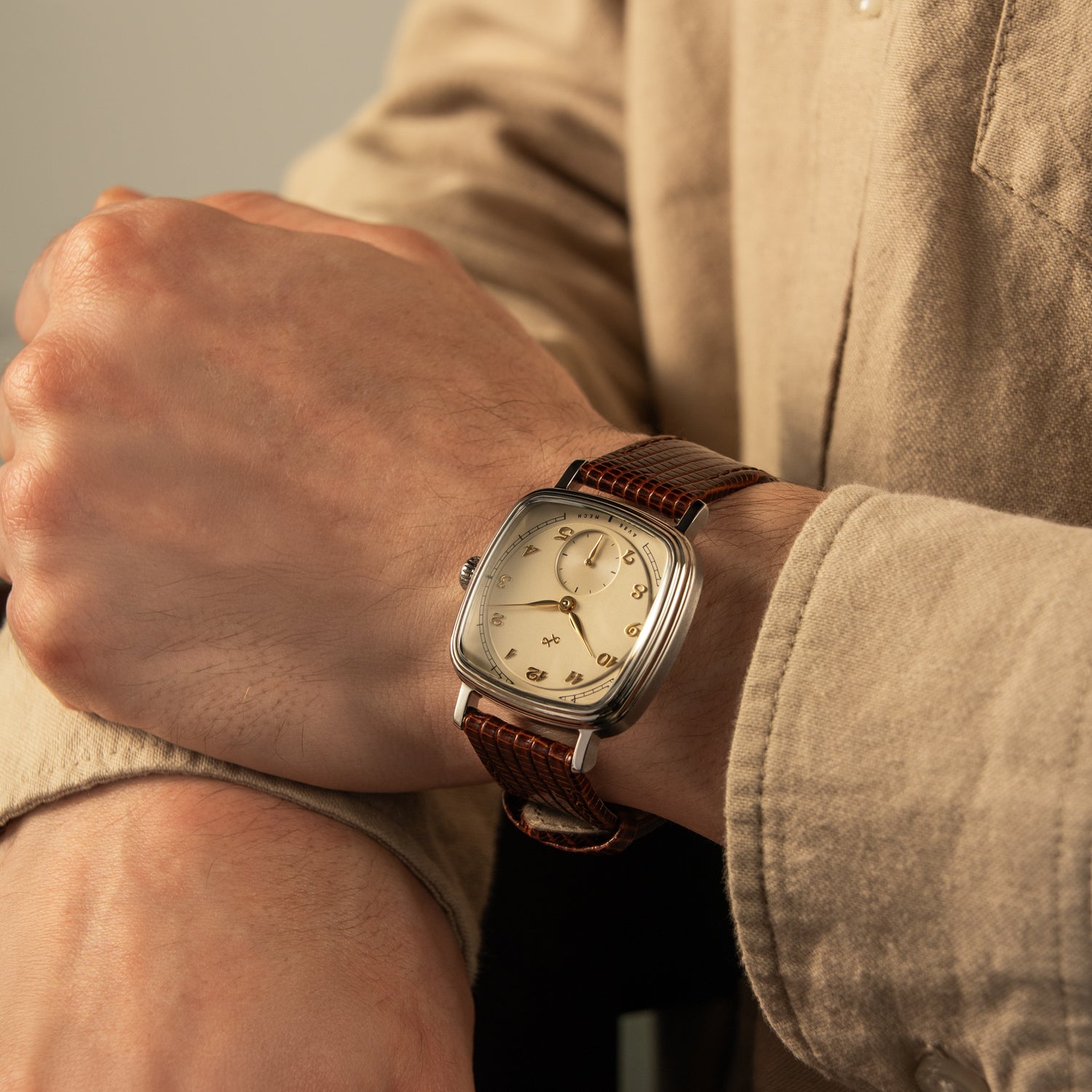 1954 Amalfi Mechanical, Steel / Off White wristwatch by AV86 with vintage-inspired design and brown leather strap on wrist