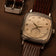 1954 Amalfi Mechanical, Steel / Off White watch by AV86 with vintage-inspired dial and brown leather strap on brown background