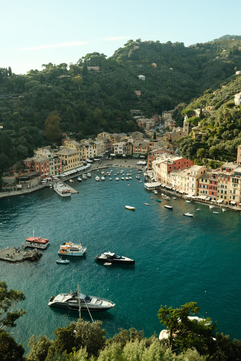 Scenic view of a coastal town with boats in harbor, evoking the elegance of the 1954 Amalfi Mechanical, Steel / Off White by AV86.