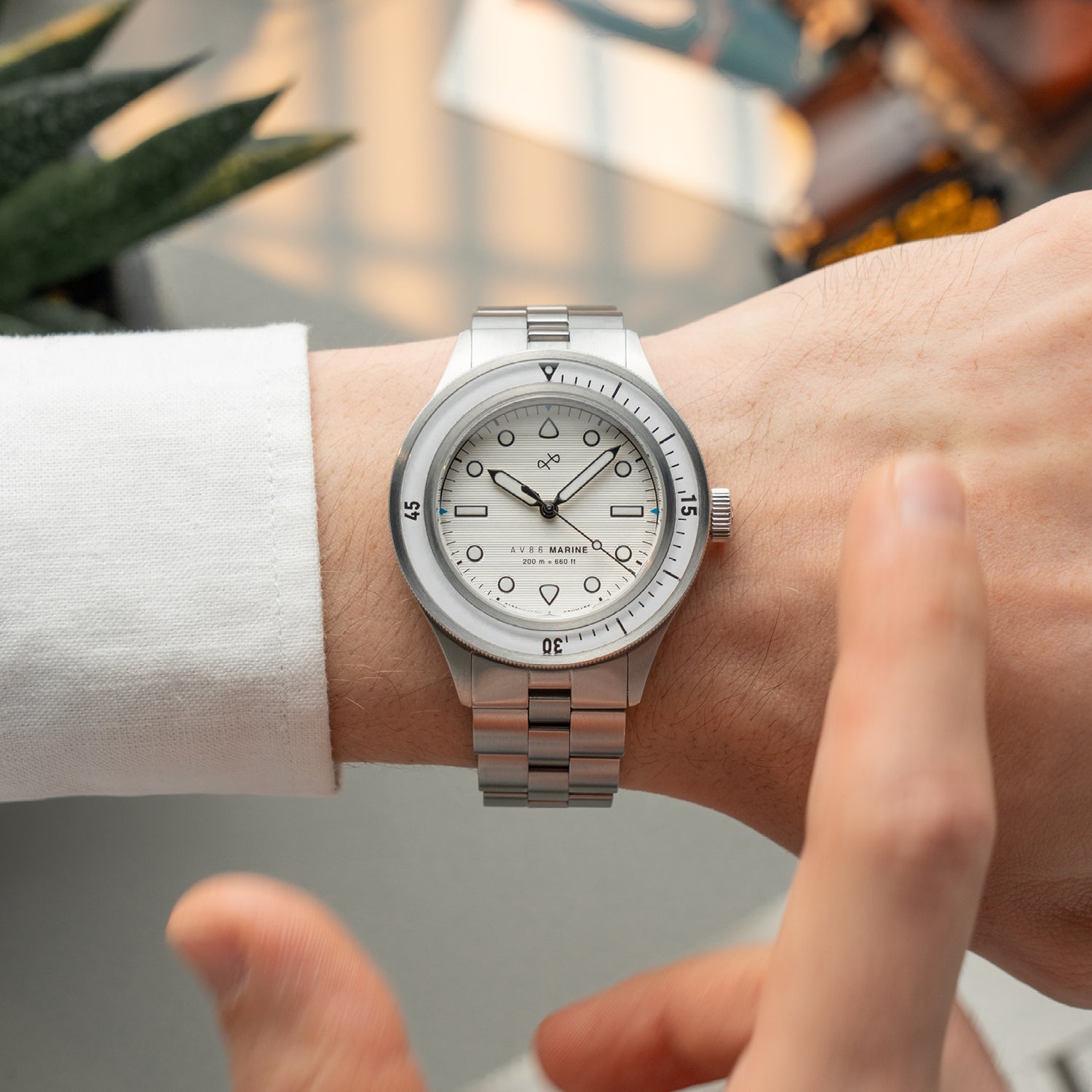 1956 Marine by AV86 luxury diver watch with sapphire crystal, vintage-inspired dial, rotating bezel, and stainless steel bracelet strap