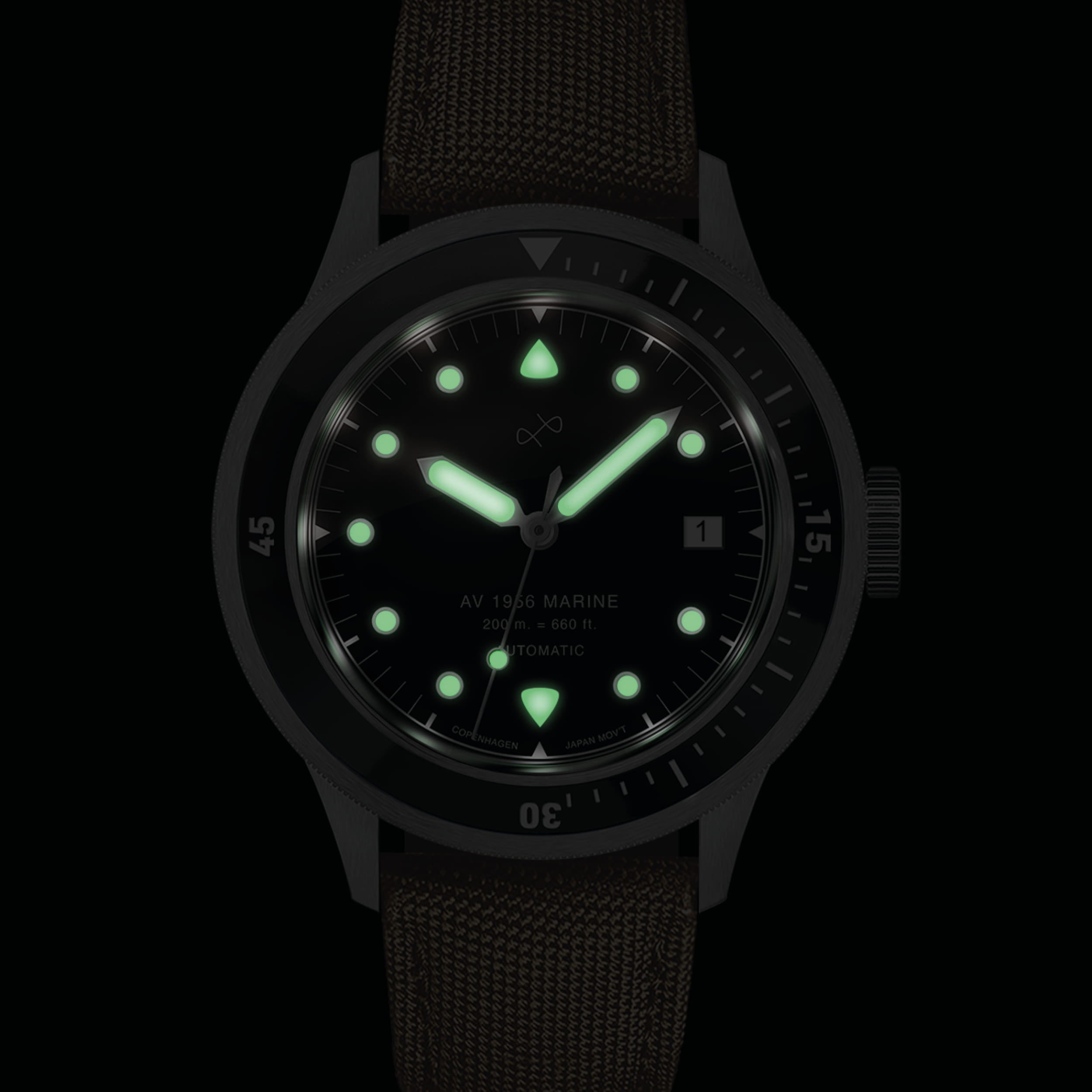1956 Marine Automatic, Steel / Black with glowing markers and hands, vintage-inspired watch by AV86 in low light setting