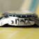 1960 Racing Chronograph by AV86 with polished crown, pushers, sapphire crystal, and textured navy leather strap