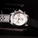 1960 Racing Chronograph by AV86 with vintage-inspired dial, sapphire crystal, tachymeter bezel, and perforated leather strap