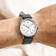 1968 Mechanical by AV86 vintage-inspired automatic watch with sapphire crystal, minimal dial, and black leather strap on wrist