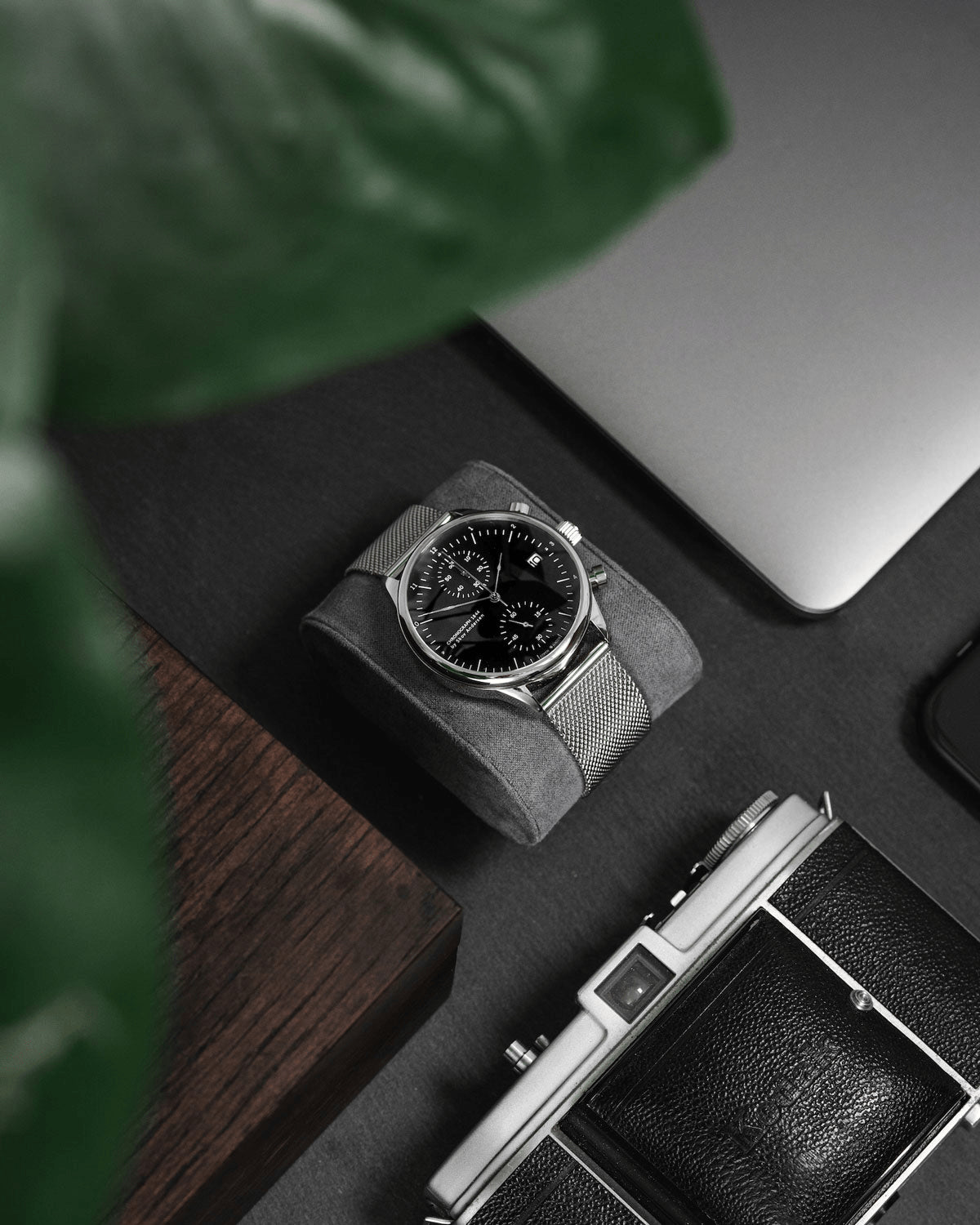 1844 Chronograph by AV86 with vintage-inspired dial, precise timing lines, sapphire crystal, and mesh metal strap in minimalist setting