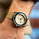 1956 Marine by AV86 vintage-inspired diver with acrylic bezel, luminous markers, textured dial, and woven fabric strap on wrist