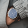 1815 Chronograph by AV86 with sapphire crystal, vintage-inspired dial, chronograph subdials, and brown leather strap on wrist