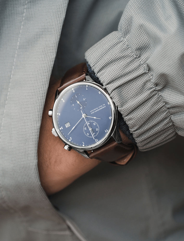 1815 Chronograph by AV86 with sapphire crystal, vintage-inspired dial, chronograph subdials, and brown leather strap on wrist