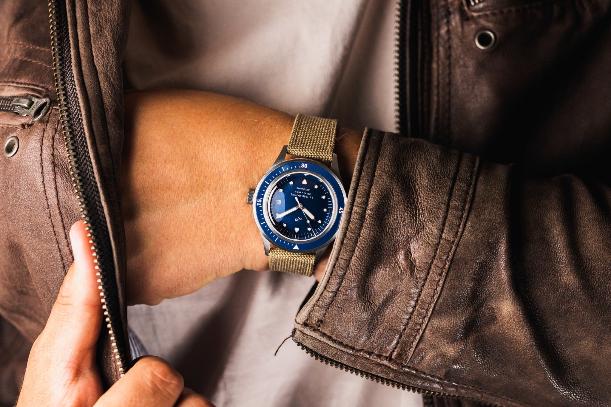 1956 Marine Automatic by AV86 vintage-inspired diver with sapphire crystal, compass bezel, and beige fabric strap