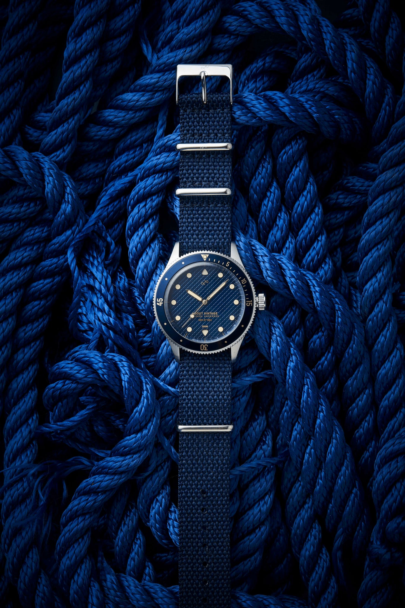 1926 At'sea, Blue Turtle Vintage by AV86 dive watch with textured dial, sapphire crystal, and fabric strap on nautical rope background